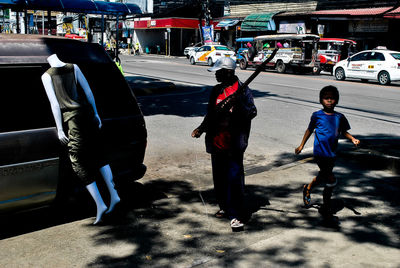 People walking on street in city