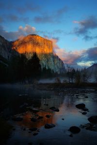 Scenic view of lake against sky during sunset