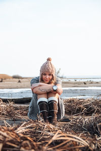 Fashion woman at seashore in autumn