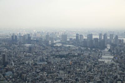 Aerial view of cityscape against clear sky