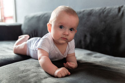 Small child lying on the sofa