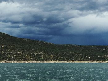 Scenic view of sea against cloudy sky