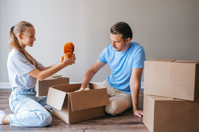 Boy playing with toy blocks at home