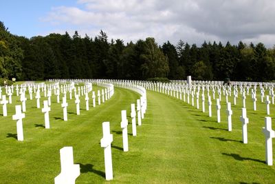 Row of cemetery against sky