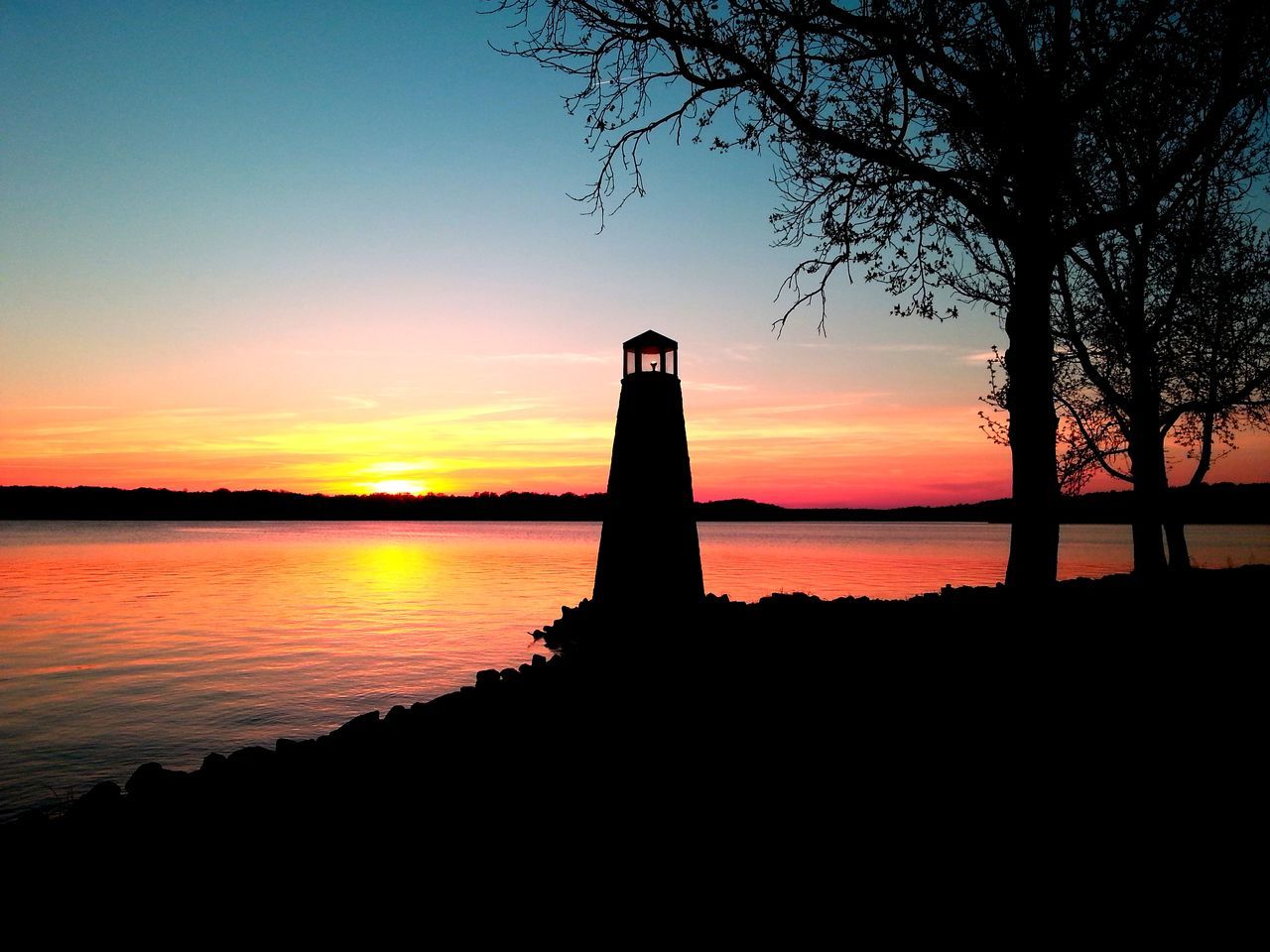 sunset, silhouette, water, tranquility, tranquil scene, scenics, orange color, sky, beauty in nature, sea, nature, idyllic, built structure, dusk, architecture, tree, no people, outdoors, outline, calm