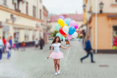 Woman with umbrella on street