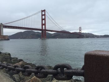 View of suspension bridge over sea