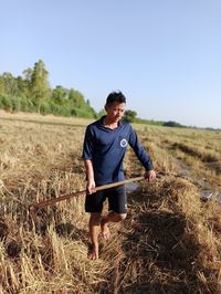 Full length of man working on field