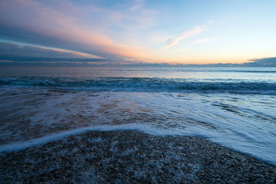 Scenic view of sea against sky during sunrise