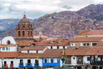 Church of the society of jesus by mountain at plaza de armas