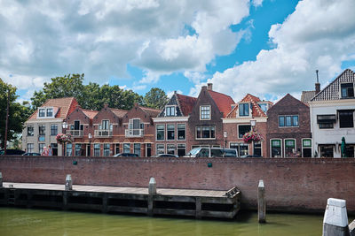 Residential buildings against sky in town