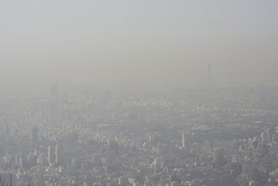 High angle view of city buildings against sky