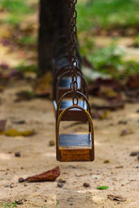 Close-up of padlock on swing