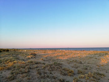 Scenic view of sea against clear blue sky