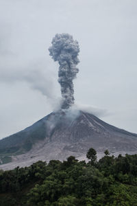 Scenic view of volcanic mountain against sky