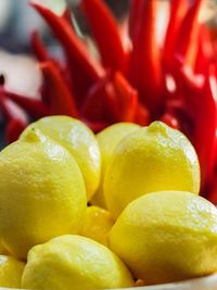 Close-up of lemons and chili peppers on table