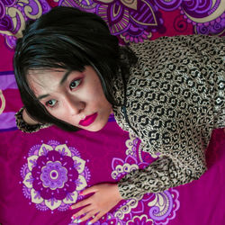 High angle portrait of girl on bed