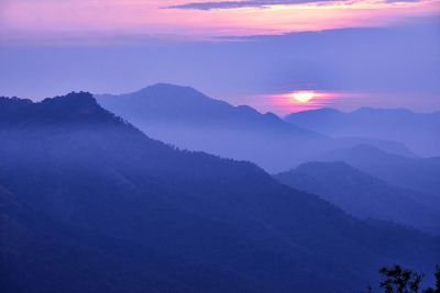 Scenic view of mountains against sky during sunset