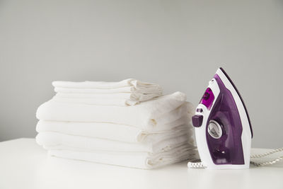 Close-up of objects on table against white background