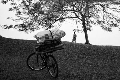 Bicycle on road against trees