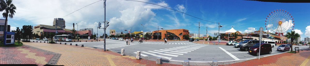 building exterior, architecture, built structure, sky, street, sunlight, blue, city, incidental people, transportation, cloud, residential structure, day, house, residential building, road, outdoors, the way forward, shadow, car