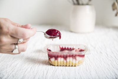 Close-up of hand holding ice cream