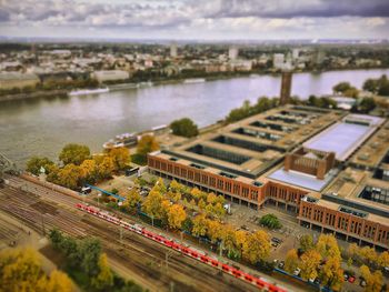 High angle view of river by city against sky