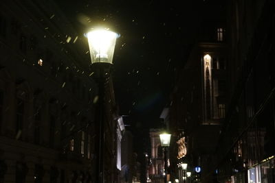 Low angle view of illuminated street light at night