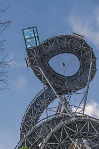 Low angle view of metallic structure against sky