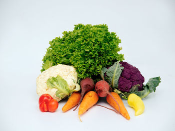 Close-up of chopped fruits against white background