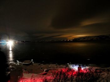 Scenic view of sea against sky at night