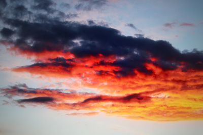 Low angle view of dramatic sky during sunset