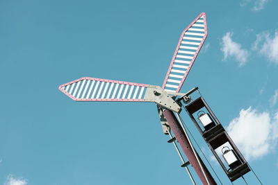 Low angle view of crane against blue sky