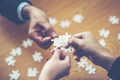 High angle view of people playing on table