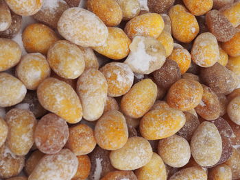 Full frame shot of salted peanuts for sale at market