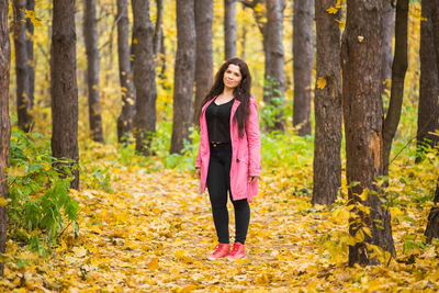 Full length of woman walking in forest