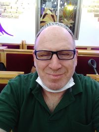 Portrait of mature man sitting at home