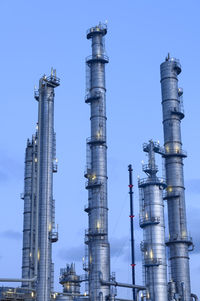 Low angle view of smoke stack against sky