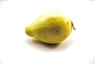 Close-up of fruits against white background