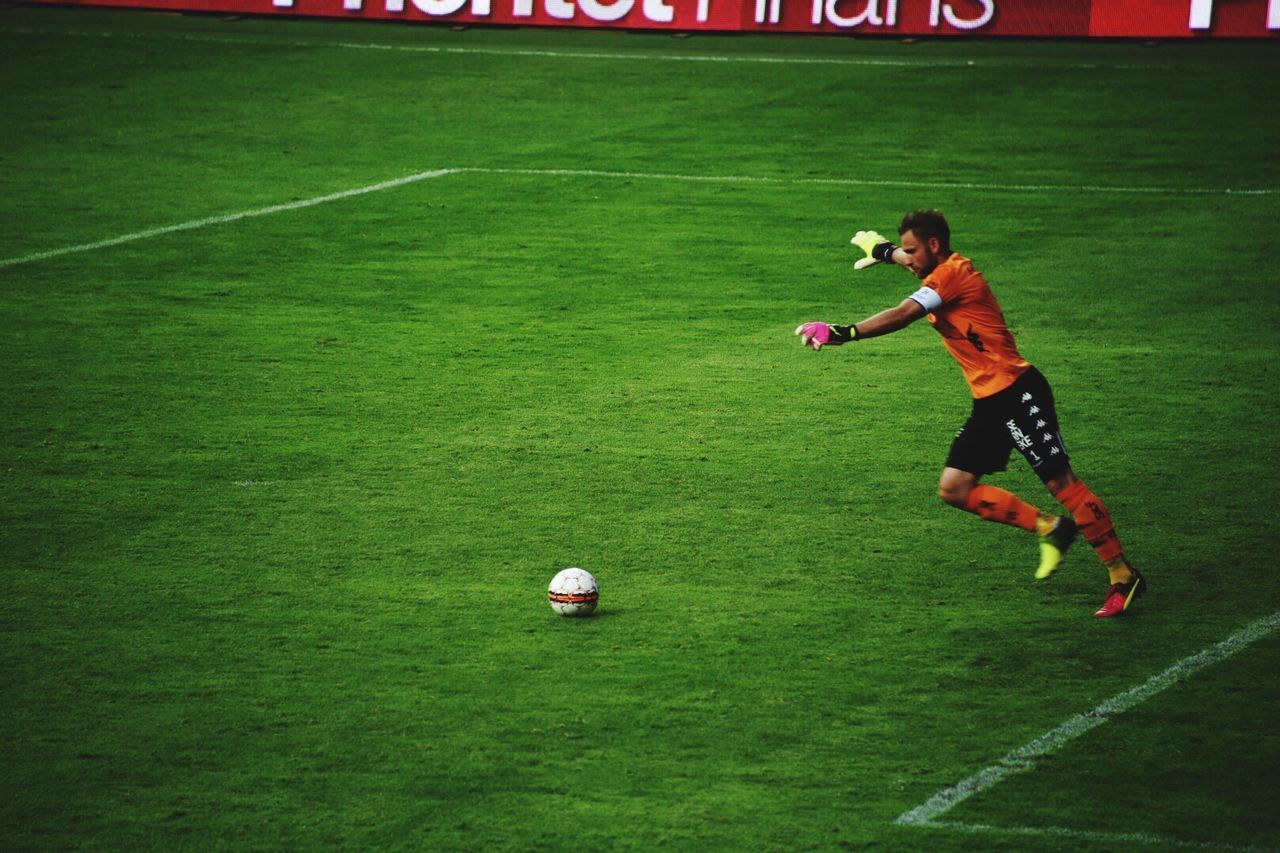 WOMAN PLAYING SOCCER ON FIELD