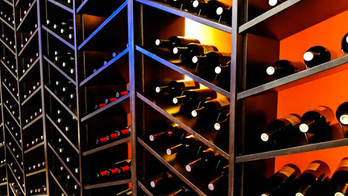 Full frame shot of wine bottles on shelf