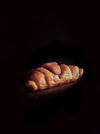 High angle view of bread on black background