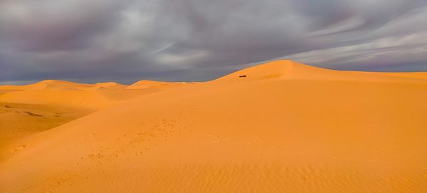 Scenic view of desert against sky