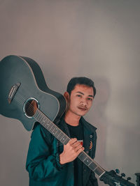 Young man playing guitar