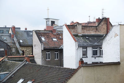 Houses in city against sky