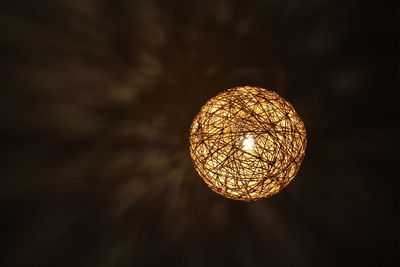 Low angle view of illuminated lamp