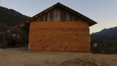 House on field against sky