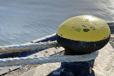 Close-up of rope tied to bollard