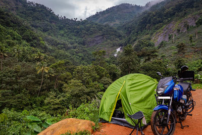 Solo traveller camping experience is expressed with his bike and tent