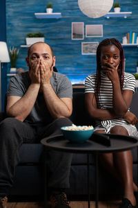 Couple watching movie at home